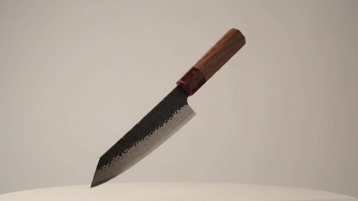 Kuroshio Kiritsuke chef knife against a light background