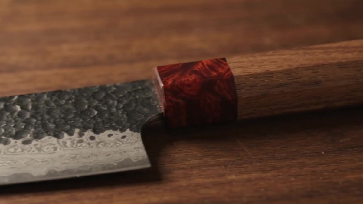 Hammered Tsuchime finish and red resin collar on the Kuroshio blade